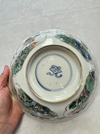A Chinese famille verte bowl with bird and butterflies among flowers, lozenge mark, Kangxi