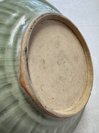 An unusual Chinese blue and white celadon-back 'Buddhist Lion' plate, Ming