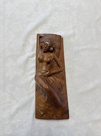 A Balinese carved wooden sculpture of a reclining lady, first half 20th C.