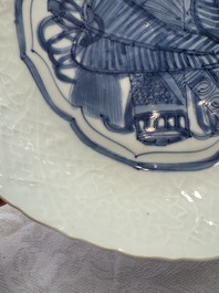 A Chinese blue and white plate with a relief-moulded rim, Wanli