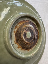 A Chinese Longquan celadon inscribed dish with incised floral design, Ming