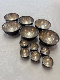 A group of 12 Chinese silver-lined coconut 'Shou 壽' bowls and cups, Wang Hengxin 王恆馨 marks, 19/20th C.