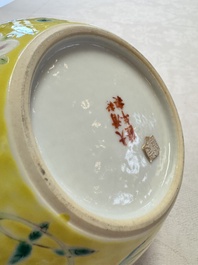 A pair of Chinese famille rose yellow-ground water pots with floral design and applied chilong and bats, Qianlong mark, 19/20th C.