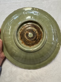 A Chinese Longquan celadon inscribed dish with incised floral design, Ming