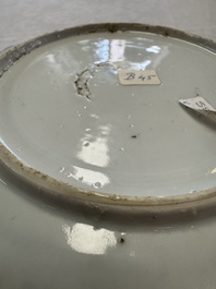 A Chinese blue and white plate with a relief-moulded rim, Wanli