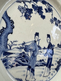 A Chinese blue and white 'Elegant Ladies in a Garden' dish, Qianlong