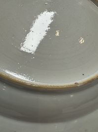 A Chinese gilt-decorated powder-blue-ground 'Elegant Beauty and Boy' dish, Kangxi