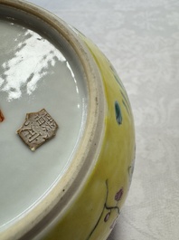 A pair of Chinese famille rose yellow-ground water pots with floral design and applied chilong and bats, Qianlong mark, 19/20th C.