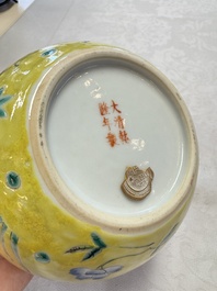 A pair of Chinese famille rose yellow-ground water pots with floral design and applied chilong and bats, Qianlong mark, 19/20th C.