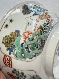 A Chinese famille verte bowl with bird and butterflies among flowers, lozenge mark, Kangxi