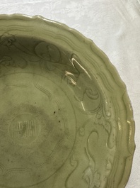 A Chinese Longquan celadon inscribed dish with incised floral design, Ming