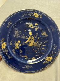 A Chinese gilt-decorated powder-blue-ground 'Elegant Beauty and Boy' dish, Kangxi