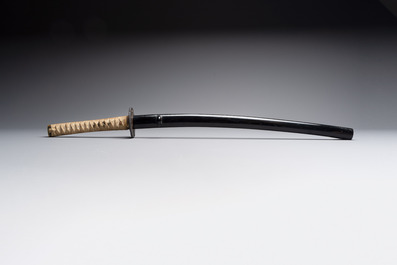 A Japanese katana, signed Yamashiro no Kami Fujiwara Kunikiyo, inscribed 'forged from Nanban tetsu' and chrysanthemum crest, with koshirae, ca. 1629-1665