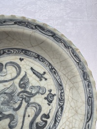 An unusual Chinese blue and white celadon-back 'Buddhist Lion' plate, Ming