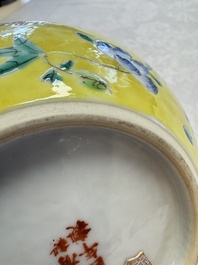 A pair of Chinese famille rose yellow-ground water pots with floral design and applied chilong and bats, Qianlong mark, 19/20th C.