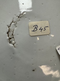 A Chinese blue and white plate with a relief-moulded rim, Wanli