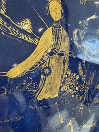 A Chinese gilt-decorated powder-blue-ground 'Elegant Beauty and Boy' dish, Kangxi