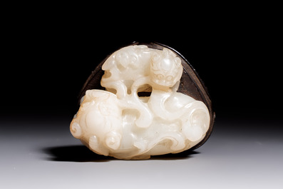 A Chinese carved jade 'Buddhist Lions' group, 19th C.