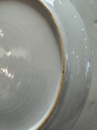 A Chinese gilt-decorated powder-blue-ground 'Elegant Beauty and Boy' dish, Kangxi