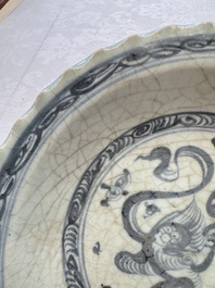 An unusual Chinese blue and white celadon-back 'Buddhist Lion' plate, Ming