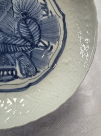 A Chinese blue and white plate with a relief-moulded rim, Wanli