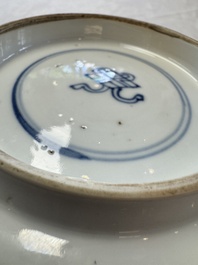 A Chinese famille verte bowl with bird and butterflies among flowers, lozenge mark, Kangxi