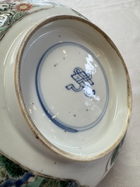 A Chinese famille verte bowl with bird and butterflies among flowers, lozenge mark, Kangxi
