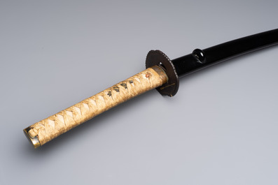 A Japanese katana, signed Yamashiro no Kami Fujiwara Kunikiyo, inscribed 'forged from Nanban tetsu' and chrysanthemum crest, with koshirae, ca. 1629-1665