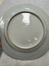 A Chinese gilt-decorated powder-blue-ground 'Elegant Beauty and Boy' dish, Kangxi