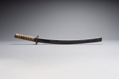 A Japanese wakizashi, signed Izumi no Kami Kanesada, with koshirae, Edo, 18/19th C.