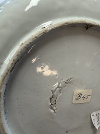 A Chinese blue and white plate with a relief-moulded rim, Wanli