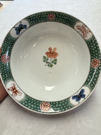 A Chinese famille verte bowl with bird and butterflies among flowers, lozenge mark, Kangxi