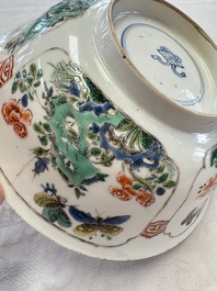 A Chinese famille verte bowl with bird and butterflies among flowers, lozenge mark, Kangxi