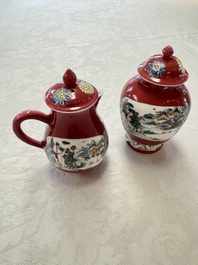 A Chinese famille rose ruby-ground 'Landscape Scroll' covered tea caddy and a covered milk jug, Yongzheng