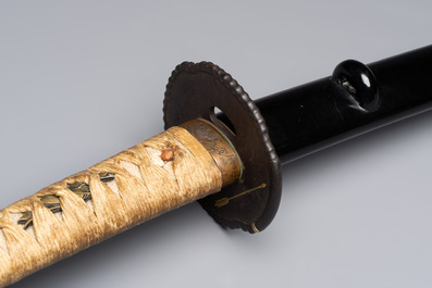 A Japanese katana, signed Yamashiro no Kami Fujiwara Kunikiyo, inscribed 'forged from Nanban tetsu' and chrysanthemum crest, with koshirae, ca. 1629-1665