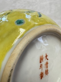 A pair of Chinese famille rose yellow-ground water pots with floral design and applied chilong and bats, Qianlong mark, 19/20th C.