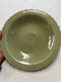 A Chinese Longquan celadon inscribed dish with incised floral design, Ming