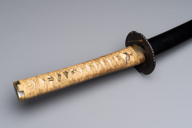 A Japanese katana, signed Yamashiro no Kami Fujiwara Kunikiyo, inscribed 'forged from Nanban tetsu' and chrysanthemum crest, with koshirae, ca. 1629-1665