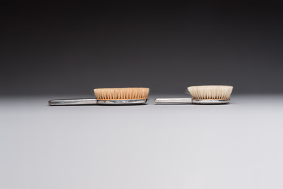 An Art Deco 12-piece silver toiletry set, Wolfers Fr&egrave;res, Brussels, 20th C.