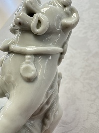 Two Chinese Dehua blanc-de-Chine Buddhist lions, three famille rose figures, and a white-glazed group, Kangxi and later