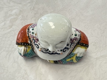 Two Chinese Dehua blanc-de-Chine Buddhist lions, three famille rose figures, and a white-glazed group, Kangxi and later