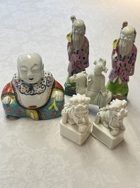 Two Chinese Dehua blanc-de-Chine Buddhist lions, three famille rose figures, and a white-glazed group, Kangxi and later
