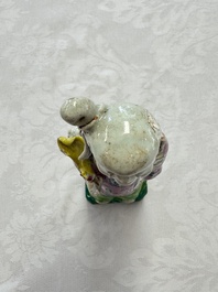 Two Chinese Dehua blanc-de-Chine Buddhist lions, three famille rose figures, and a white-glazed group, Kangxi and later