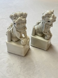 Two Chinese Dehua blanc-de-Chine Buddhist lions, three famille rose figures, and a white-glazed group, Kangxi and later