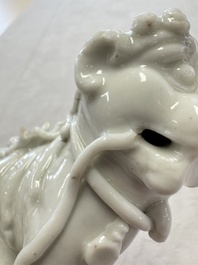 Two Chinese Dehua blanc-de-Chine Buddhist lions, three famille rose figures, and a white-glazed group, Kangxi and later