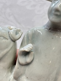 Two Chinese Dehua blanc-de-Chine Buddhist lions, three famille rose figures, and a white-glazed group, Kangxi and later