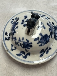 A pair of Chinese blue and white covered vases and two covered jars, Kangxi mark, 19th C