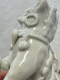 Two Chinese Dehua blanc-de-Chine Buddhist lions, three famille rose figures, and a white-glazed group, Kangxi and later