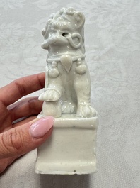 Two Chinese Dehua blanc-de-Chine Buddhist lions, three famille rose figures, and a white-glazed group, Kangxi and later