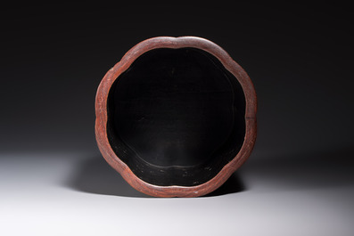A Chinese gilt black-lacquered huanghuali brush pot with chilong design, Kangxi/Yongzheng